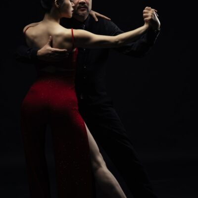 a man and a woman dancing in the dark